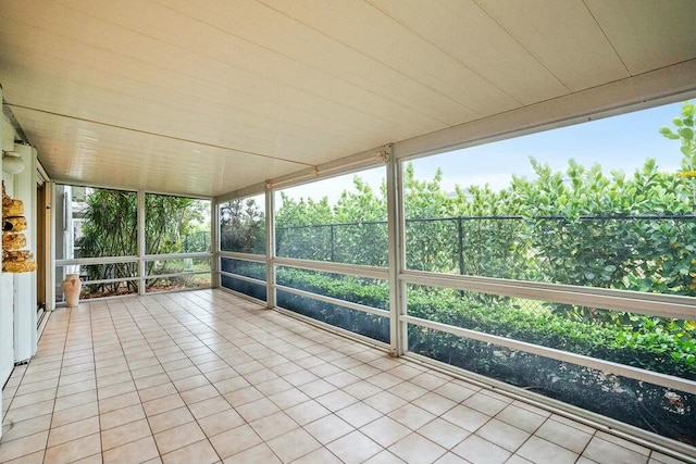 unfurnished sunroom with plenty of natural light