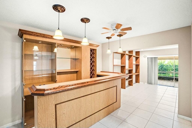 7410 Pine Forest Cir W, Lake Worth, FL 33467 - interior space with light tile patterned flooring, ceiling fan, hanging light fixtures, bar, and baseboards