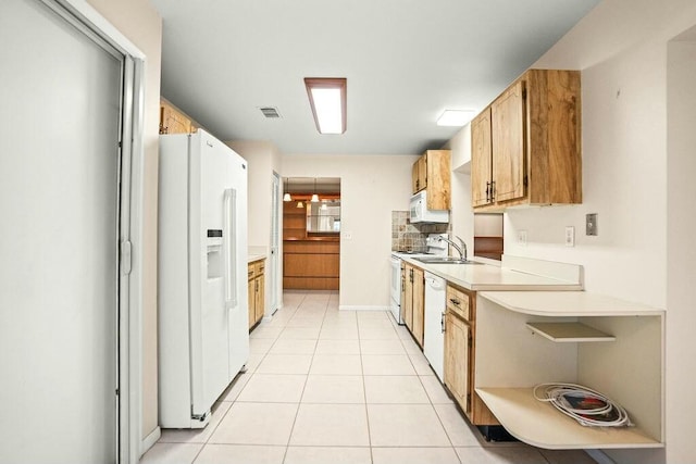 kitchen with ceiling fan, sink, light tile patterned flooring, and white appliances