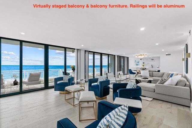 living room with floor to ceiling windows, a water view, a wealth of natural light, and light hardwood / wood-style flooring