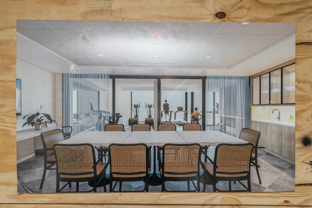 dining space featuring a raised ceiling