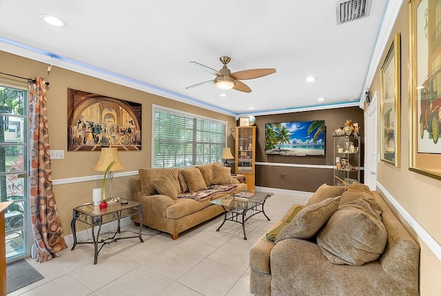 living room featuring crown molding, ceiling fan, and light tile patterned floors