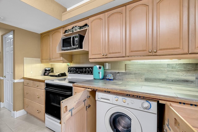 kitchen with light brown cabinetry, backsplash, light tile patterned floors, white electric range, and washer / dryer