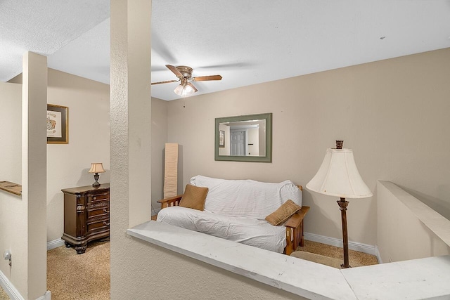 carpeted living room featuring ceiling fan