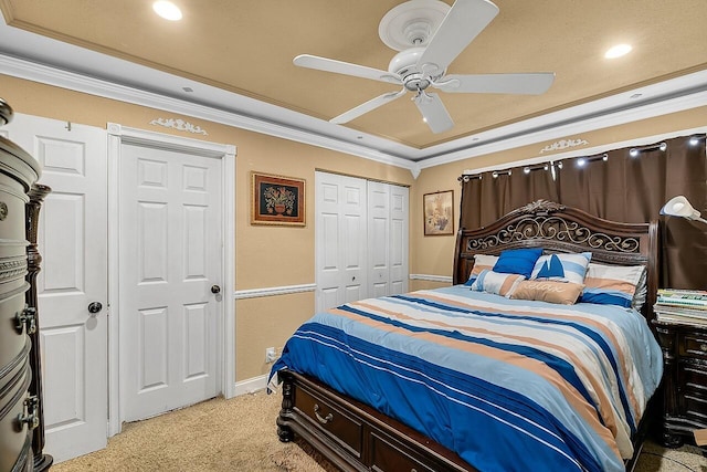 carpeted bedroom featuring ceiling fan and crown molding