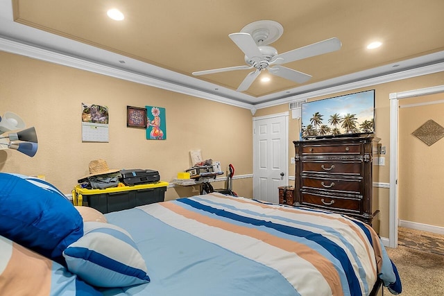 carpeted bedroom with ceiling fan and ornamental molding