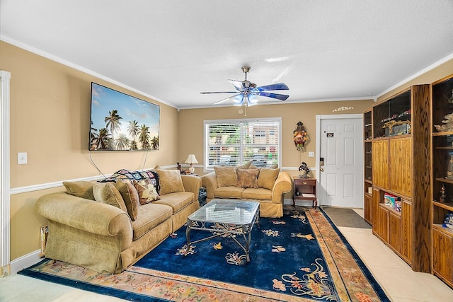 living room featuring tile patterned floors, ceiling fan, crown molding, and a textured ceiling