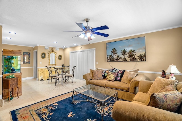 tiled living room featuring ceiling fan, ornamental molding, and a textured ceiling