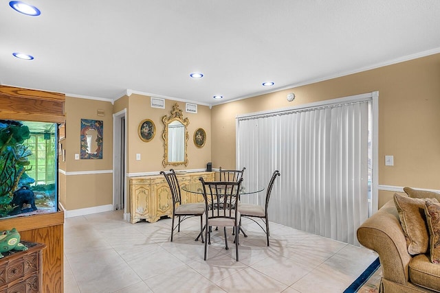 dining room with ornamental molding and light tile patterned floors