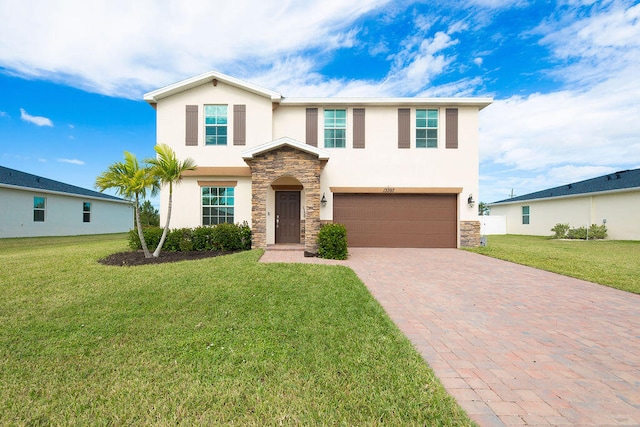 view of front of home featuring a garage and a front yard