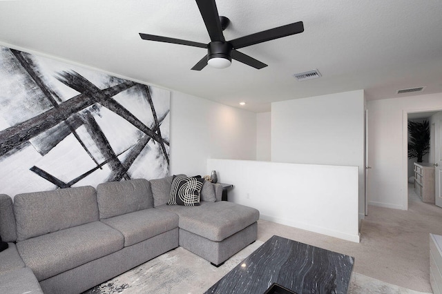 living room with ceiling fan and light colored carpet