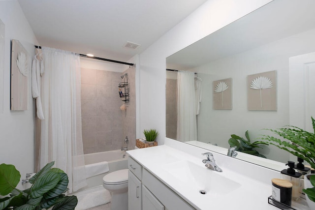 full bathroom featuring tile patterned floors, vanity, toilet, and shower / tub combo