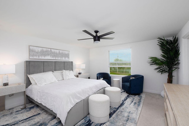 bedroom with light carpet and ceiling fan