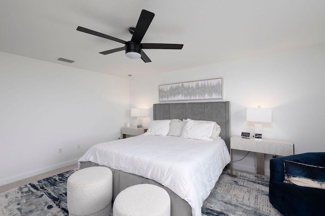 bedroom with ceiling fan and carpet floors