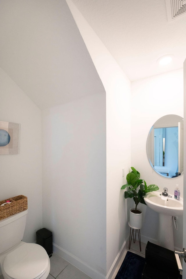 bathroom featuring tile patterned floors and toilet