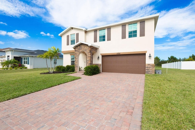 view of front of house featuring a front lawn and a garage