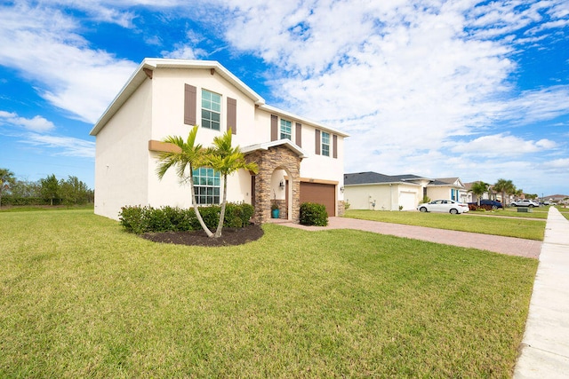 view of front of house with a front lawn and a garage