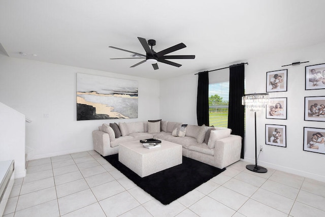 living room featuring ceiling fan and light tile patterned floors