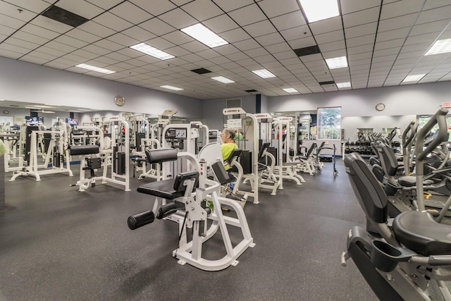 exercise room featuring a drop ceiling