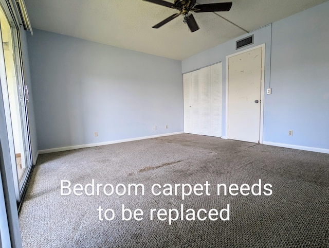 unfurnished bedroom with carpet flooring, ceiling fan, and a closet