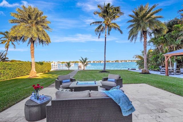 view of patio with a gazebo, an outdoor living space, and a water view