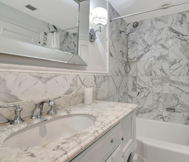 bathroom with vanity and shower / bath combination with curtain