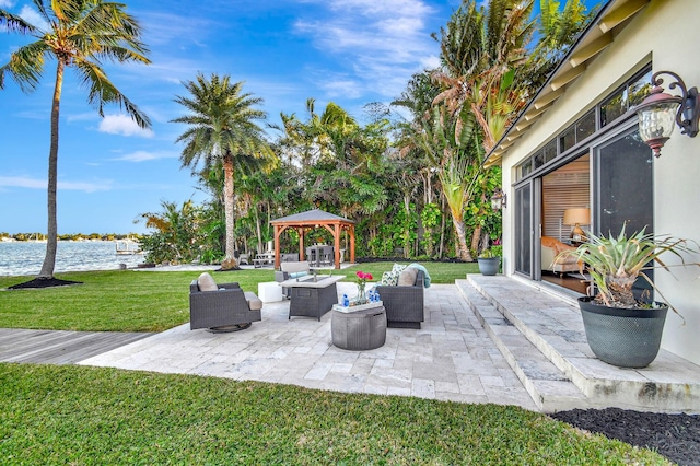 view of patio with a water view, a gazebo, and outdoor lounge area