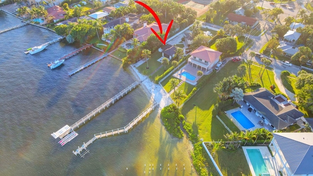 birds eye view of property featuring a water view