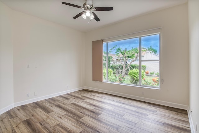 unfurnished room featuring ceiling fan and light hardwood / wood-style flooring