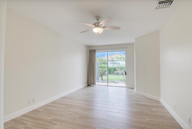 unfurnished room featuring ceiling fan and light hardwood / wood-style flooring