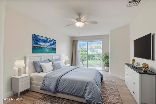 bedroom with ceiling fan, access to exterior, and light hardwood / wood-style flooring