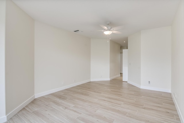 spare room featuring ceiling fan and light wood-type flooring