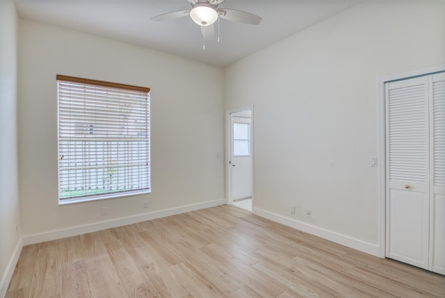 unfurnished room featuring ceiling fan and light wood-type flooring