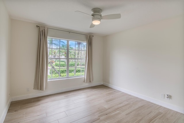 unfurnished room featuring ceiling fan and light hardwood / wood-style floors