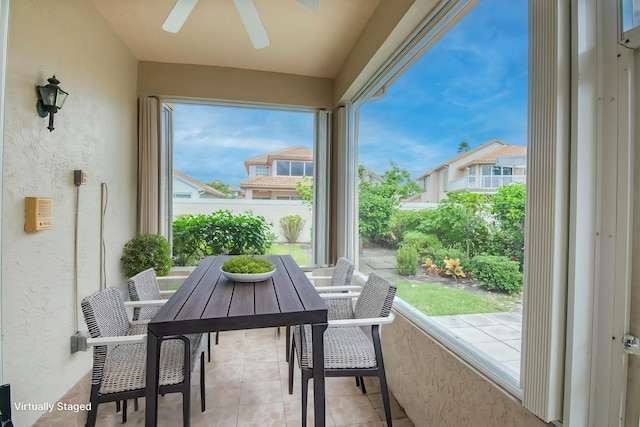 sunroom with ceiling fan and a wealth of natural light