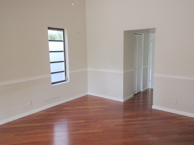 empty room featuring dark wood-type flooring