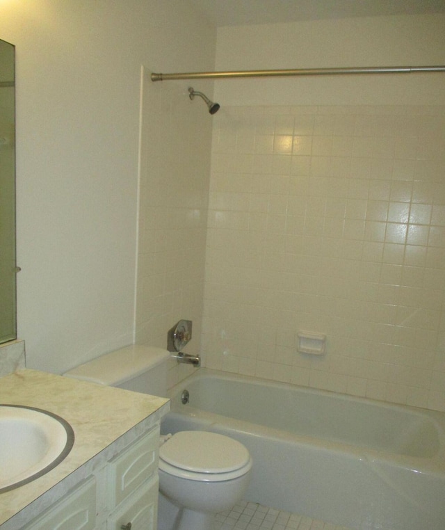 bathroom with toilet, shower / tub combination, tile patterned flooring, and vanity