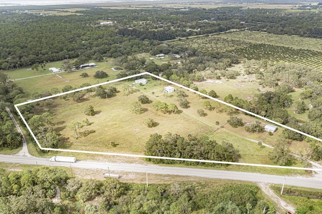 birds eye view of property featuring a rural view