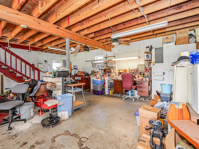 garage with a workshop area and a garage door opener