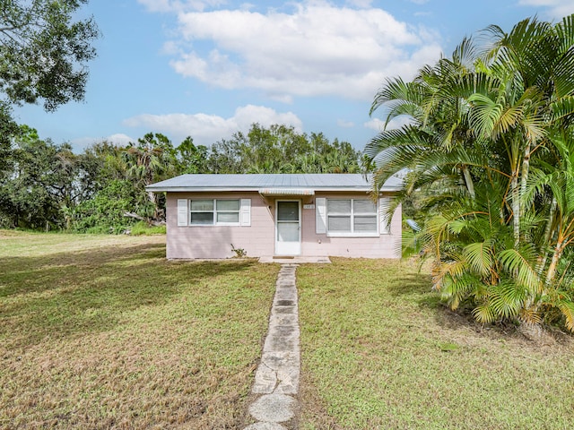 view of front of home with a front yard