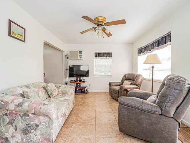 living room with ceiling fan, light tile patterned floors, and a wall mounted air conditioner