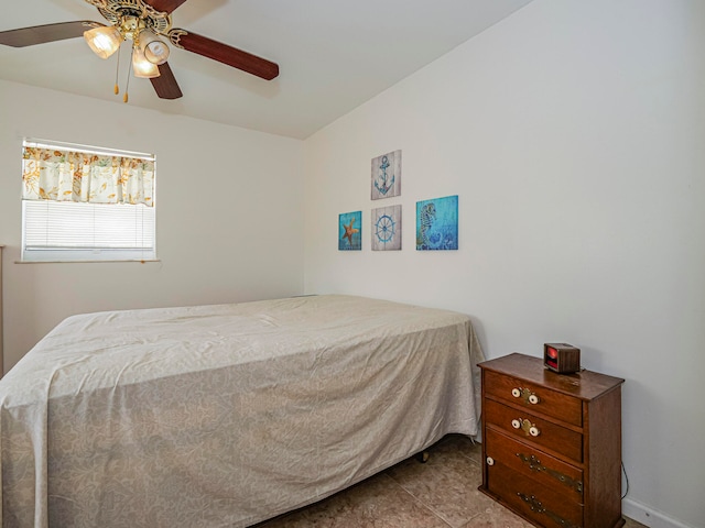 bedroom featuring light tile patterned flooring and ceiling fan