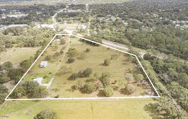 birds eye view of property with a rural view