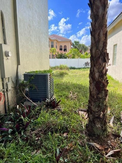 view of yard with central AC