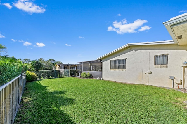 view of yard featuring a sunroom