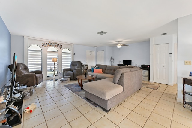 tiled living room featuring ceiling fan