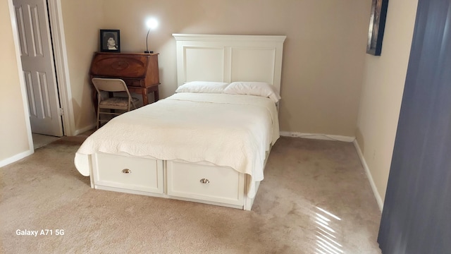 bedroom featuring light carpet