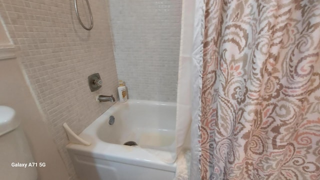 bathroom featuring shower / bath combination with curtain