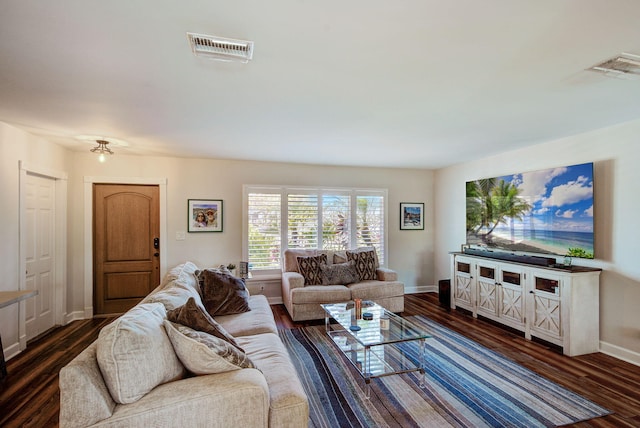 living room with dark hardwood / wood-style flooring