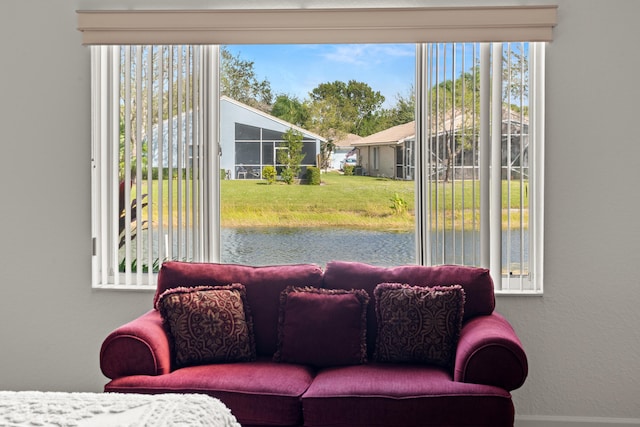 interior space featuring a water view and a healthy amount of sunlight